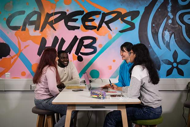 Image of students working at a desk