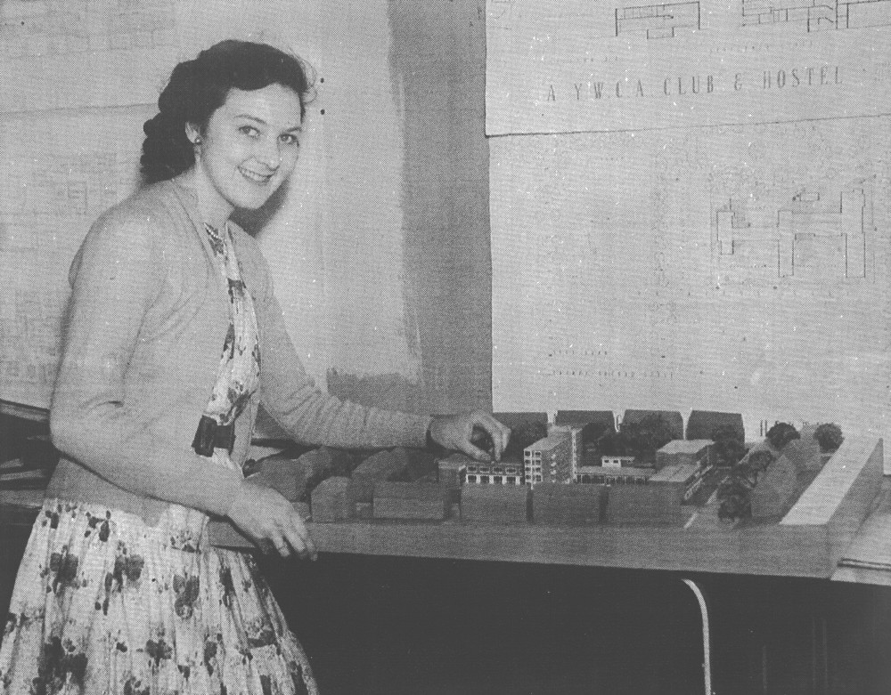 Mary Arthur with her drawings and model for her final thesis of a youth club and hostel
