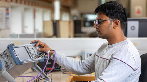 Student working with electronic device