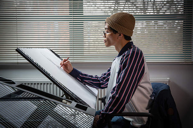 Animation student drawing a skeleton on a large sketchpad